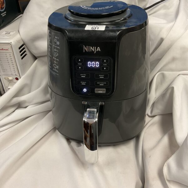 Black Ninja air fryer with digital display and handle.