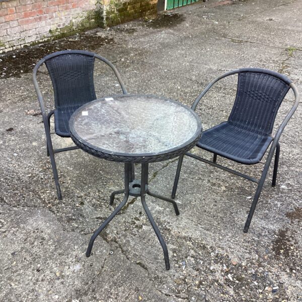 Vintage garden table and chairs set for outdoor dining.