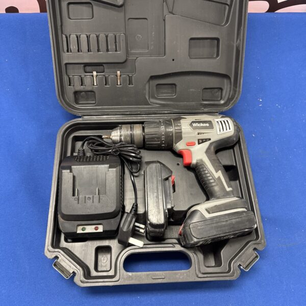 Wickes cordless drill in open carrying case with battery and charger.