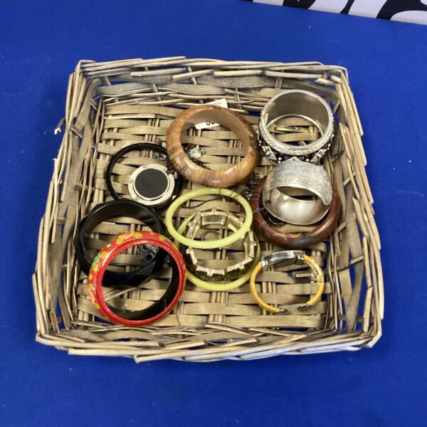 Colourful bangle lot with assorted bracelets and fashion accessories.