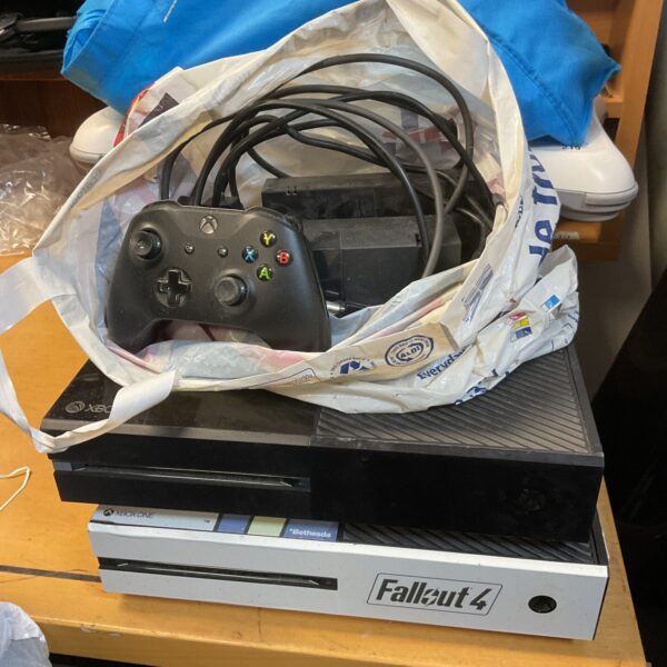 Xbox One console lot with controller and power supply.