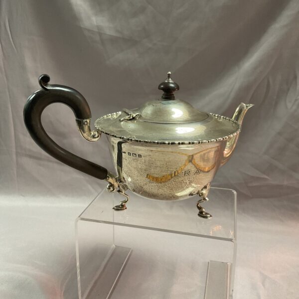 Antique sterling silver teapot with three legs, hallmarked silver.