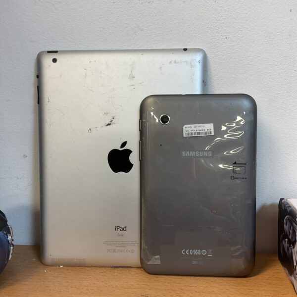Apple iPad and Samsung Galaxy tablets presented as-found.