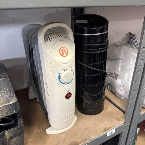 White oil filled radiator with small fan and dial control.