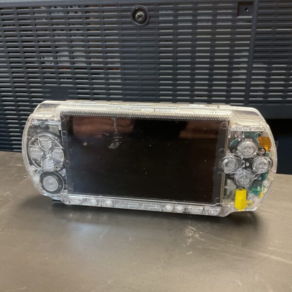 Front view of a transparent Sony PSP console.