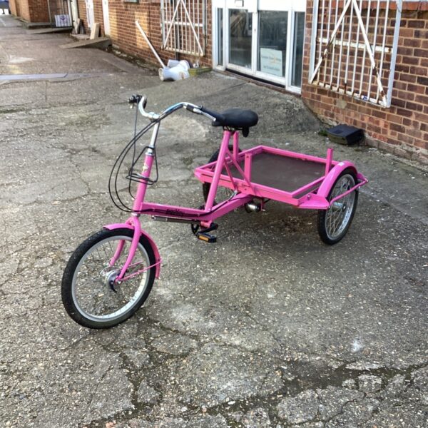 Vintage Pashley tricycle in need of restoration, classic three-wheeled bike.