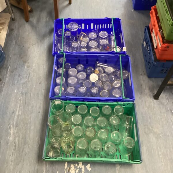 Mixed lot of branded pub glasses in crates.