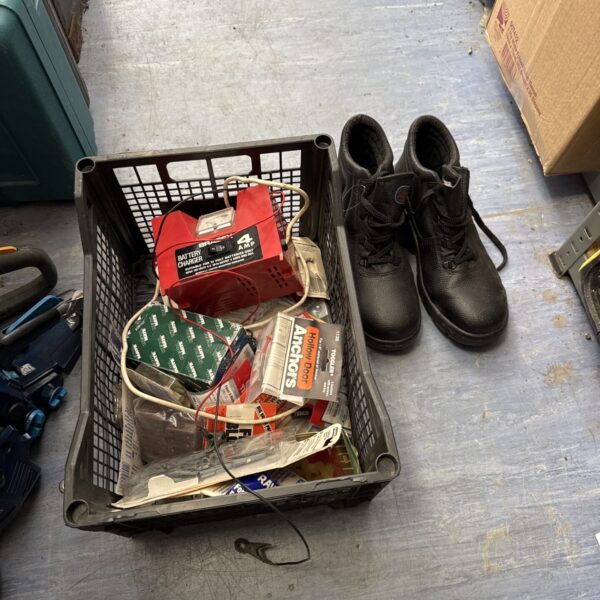 Shed clearance lot with safety boots and various tools.