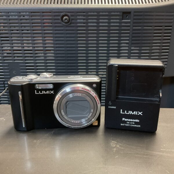 Panasonic Lumix DMC-TZ8 digital camera with battery charger.