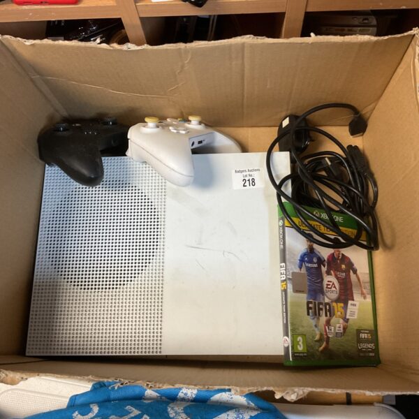 Used Xbox One console with controllers, gaming system.