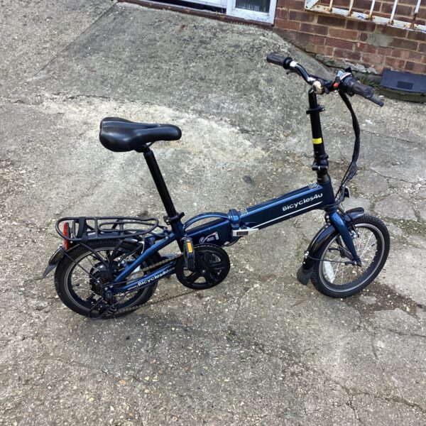 Side view of a used electric folding bike for auction.