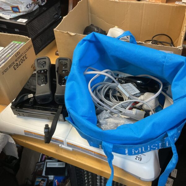 Black Nintendo Wii console with controllers and accessories.