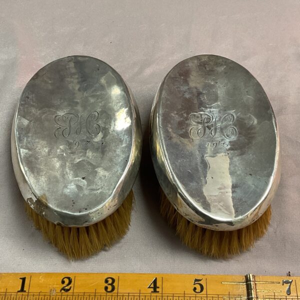 Antique 1924 silver clothes brushes, hallmarked and in good condition.