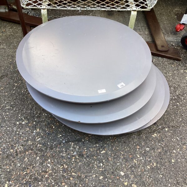 Vintage rotating low table with a circular tabletop.