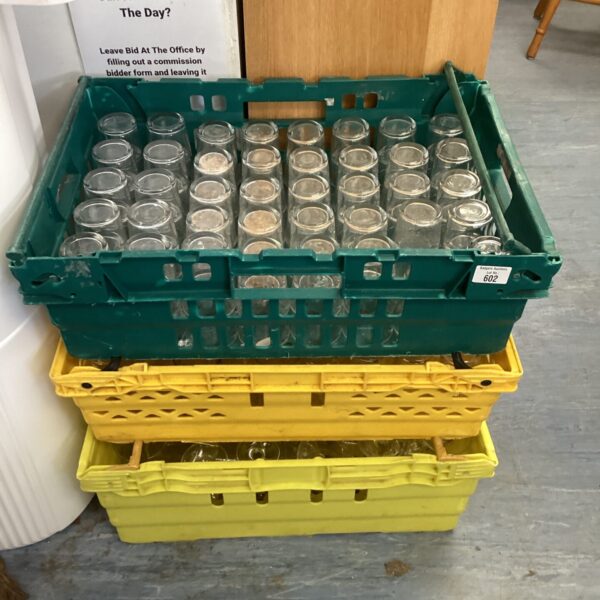 Mixed lot of pub glasses in crates, ideal for collectors.