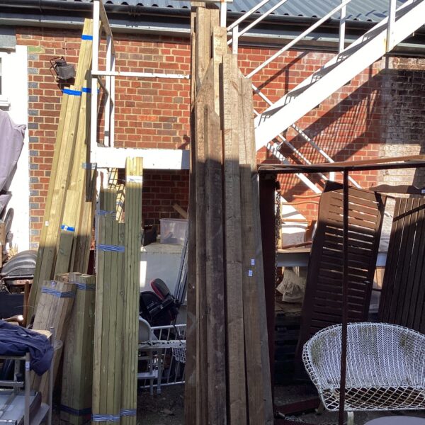 Stack of rough sawn timber boards for DIY projects.