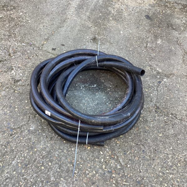 Black flexible pond hose for garden irrigation.