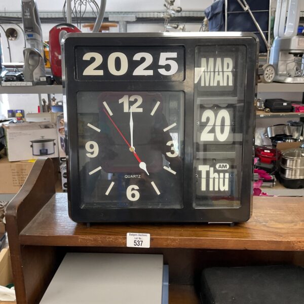 Vintage day date quartz clock with digital display.