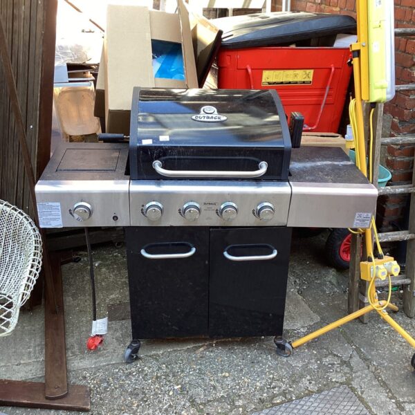 Black Outback Apollo 4 gas BBQ for outdoor cooking.