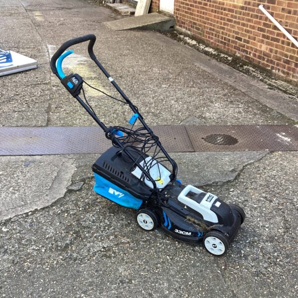 Mac Allister 33cm lawn mower in a garden setting.