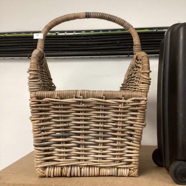 Large wicker basket for storage and farmhouse decor.