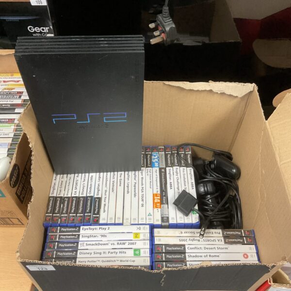 Sony PlayStation 2 console bundle with games and controllers.