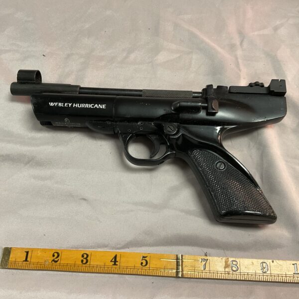 Vintage Webley Hurricane .22 air pistol with wooden grips.
