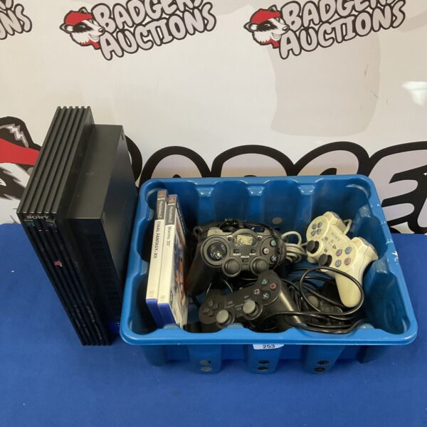 Sony PlayStation 2 console with games and controllers