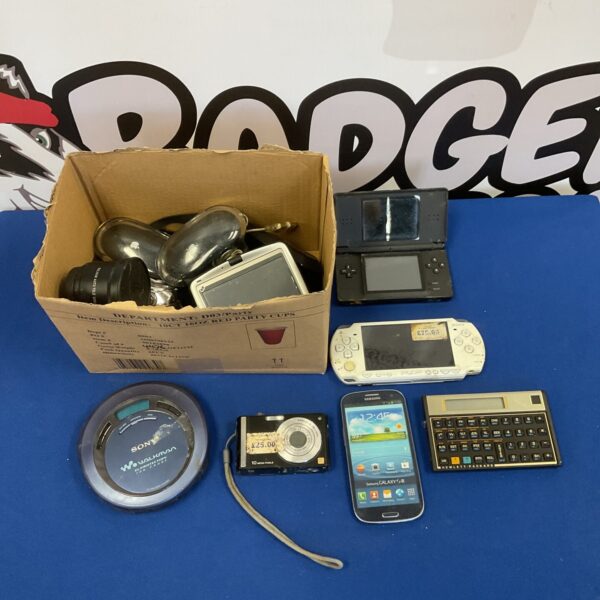 Mixed lot of vintage games consoles and accessories in poor condition.