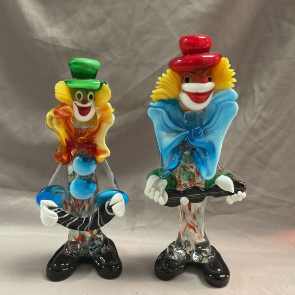 Pair of vintage Murano glass clown figurines with colorful details.