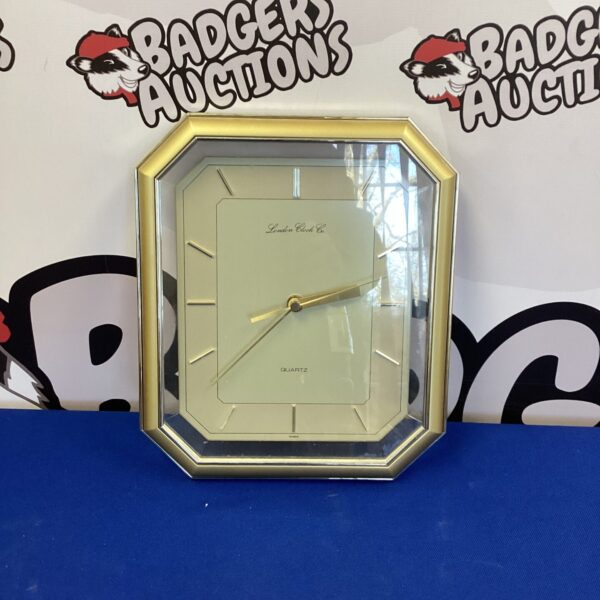 Vintage London Clock Company quartz wall clock with gold housing.
