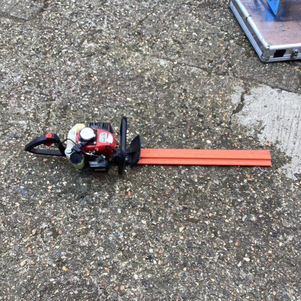Used Kawasaki TG18 hedge cutter for garden landscaping.