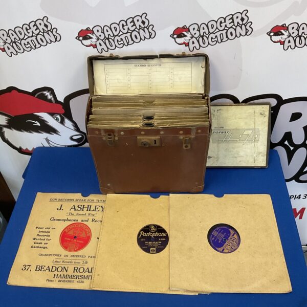 Vintage gramophone records in a carrying case, 78 RPM shellac discs.