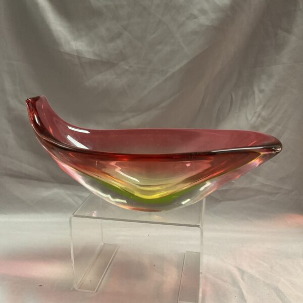 Vibrant cranberry glass vase with sculptural form.