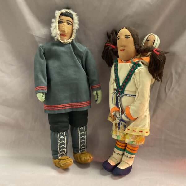 Two vintage Inuit fabric dolls from Baffin Island, showcasing traditional clothing.