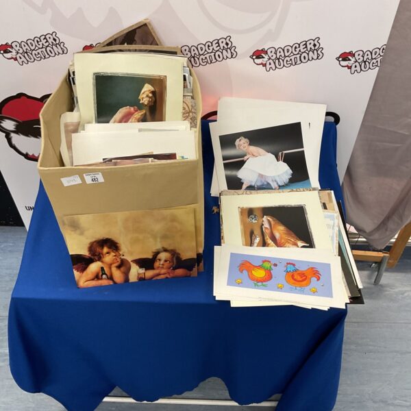 Large lot of unframed prints including Marilyn Monroe images.