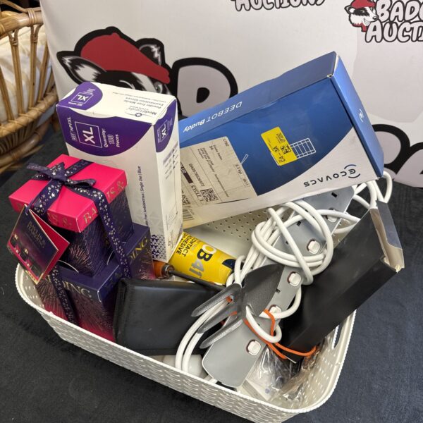 Woven basket containing a Baylis & Harding gift set and house clearance items.