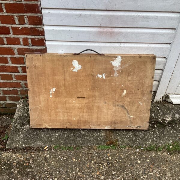 Vintage paste table with a wooden surface and carrying handle.