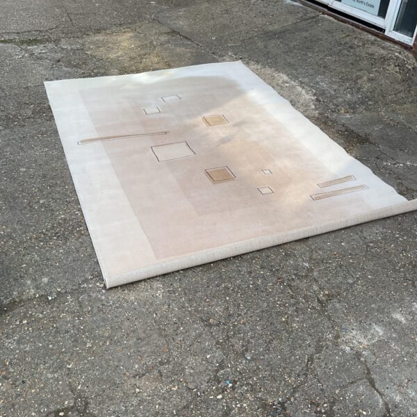 Neutral patterned Belgium wool rug, 8ft x 5ft, for home decor.