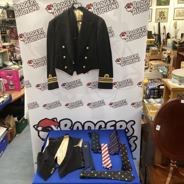 Vintage navy officer's jacket with waistcoats and ties.