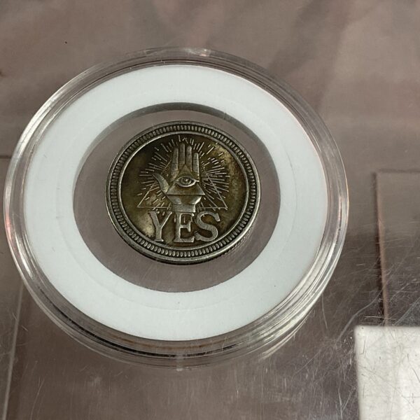 Front view of the yes or no decision coin in a clear holder.