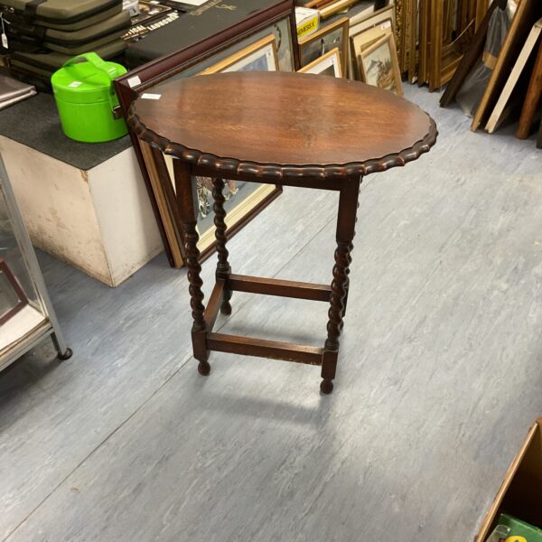 Vintage mahogany lamp table with barley twist legs and pie crust top.