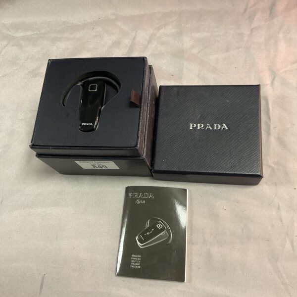 Black Prada Bluetooth headset presented for auction.