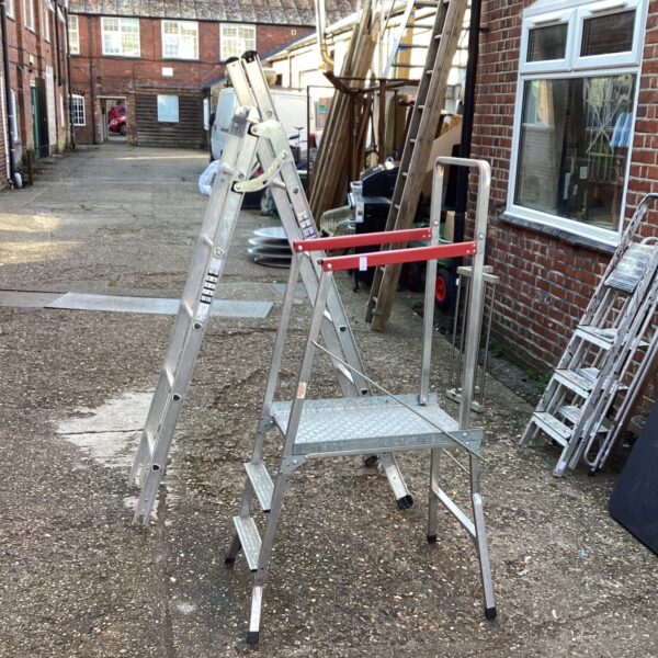Vintage Beldry Jobster step ladder in a courtyard setting.