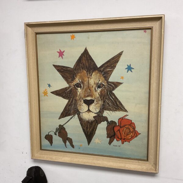 Vintage fleur print of a lion's head, striking animal portrait.