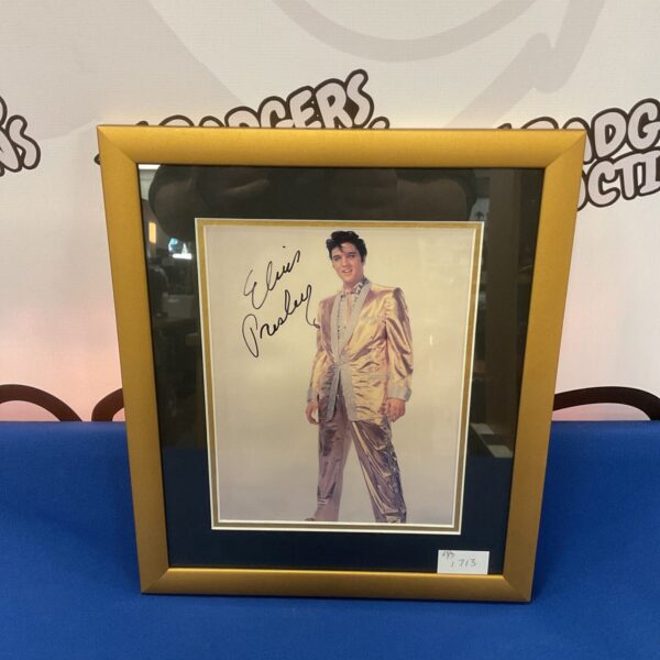 Signed Elvis Presley photograph with certificate of authenticity.