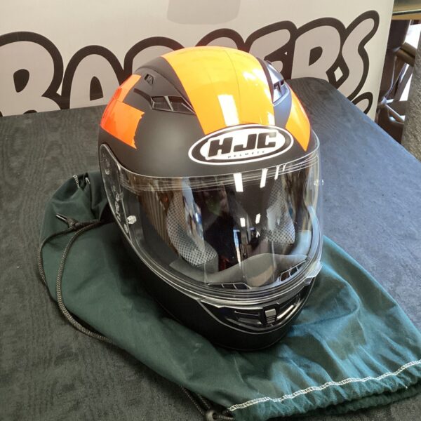 Front view of a black and orange HJC CS-15 motorcycle helmet.