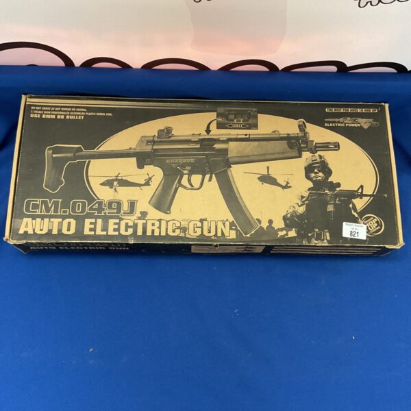 Vintage Cm.049J BB gun in original box, collectible toy.