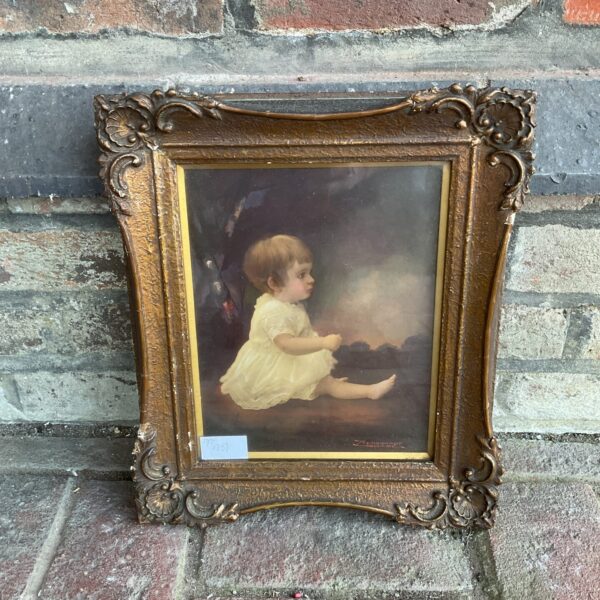 Antique oil painting of a baby girl in Rembrandt style.