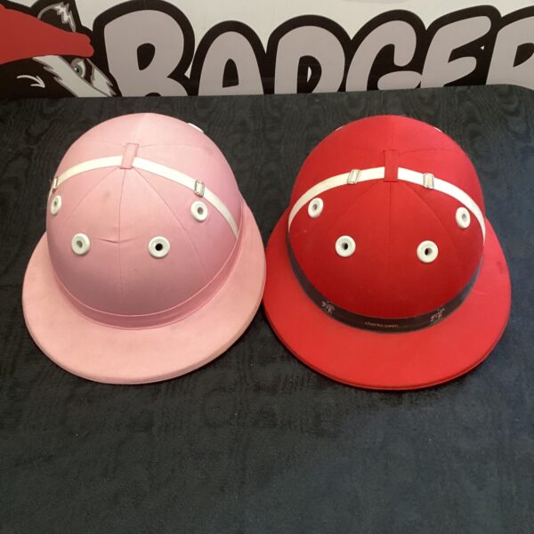 Pink Charles Owen Younger Riders polo helmet for equestrian safety.